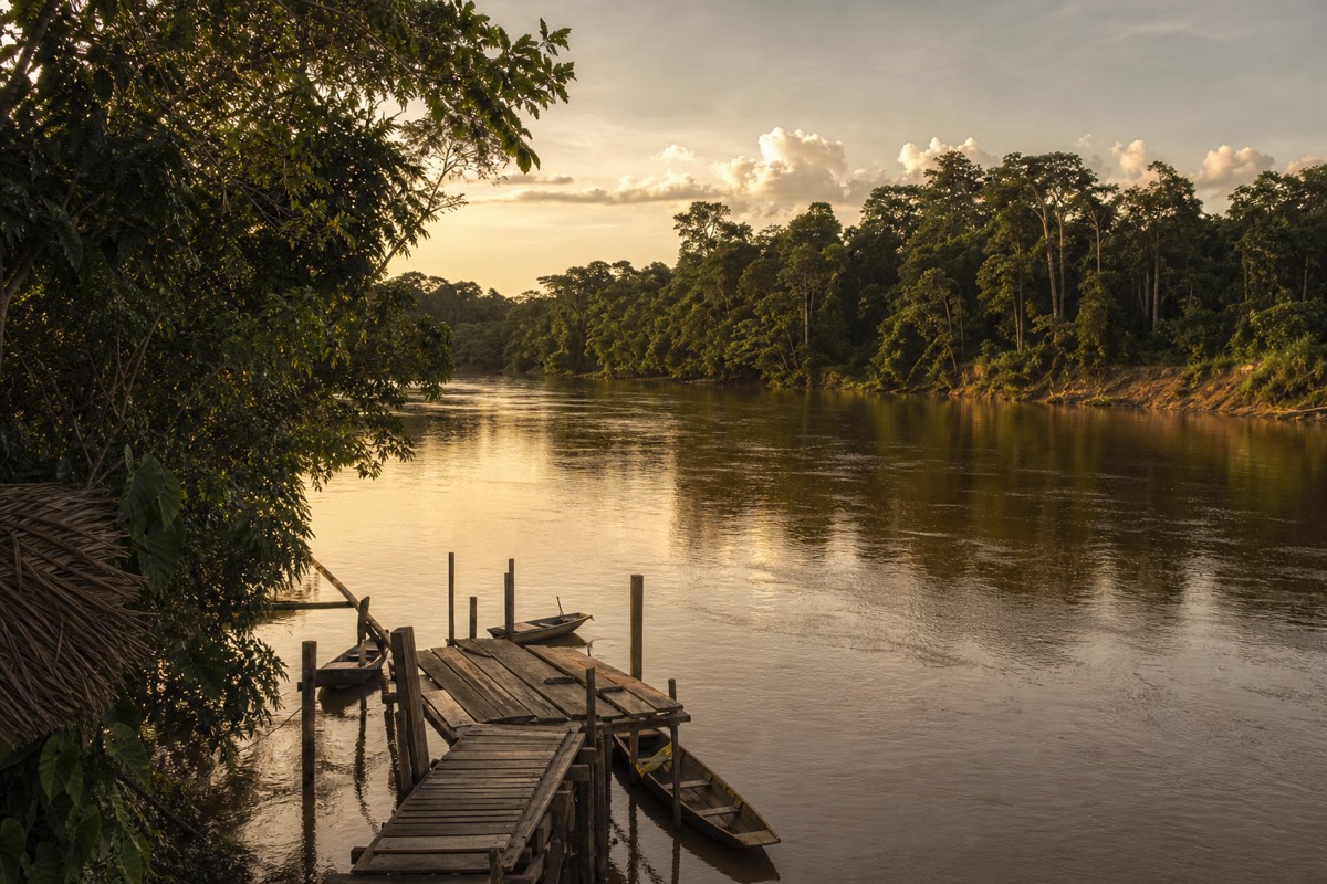 The Peruvian Amazon with the wide river winding near Iquitos at dusk