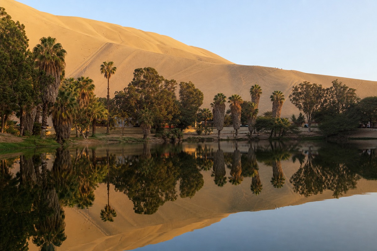 The Huacachina oasis surrounded by desert dunes, a dry landscape to consider when packing for the Inca Trail