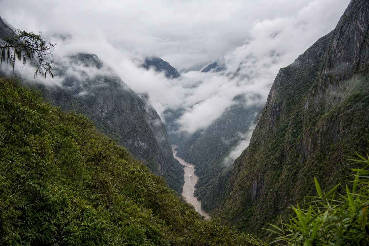 Andes river valley in mist near Ollantaytambo in the Sacred Valley Peru