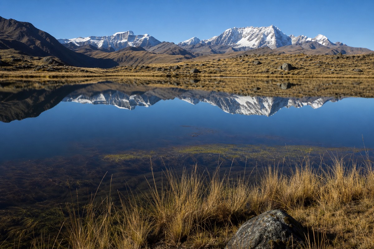 Highland lake reflecting the peaks of the Peruvian Andes, scenery seen on a Rainbow Mountain day trip from Cusco